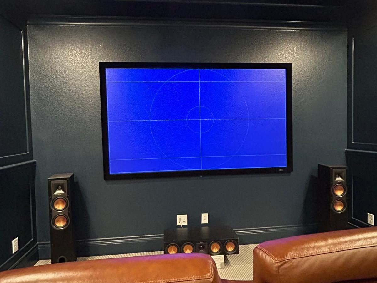 Home theater with center channel speaker, side towers and recliners